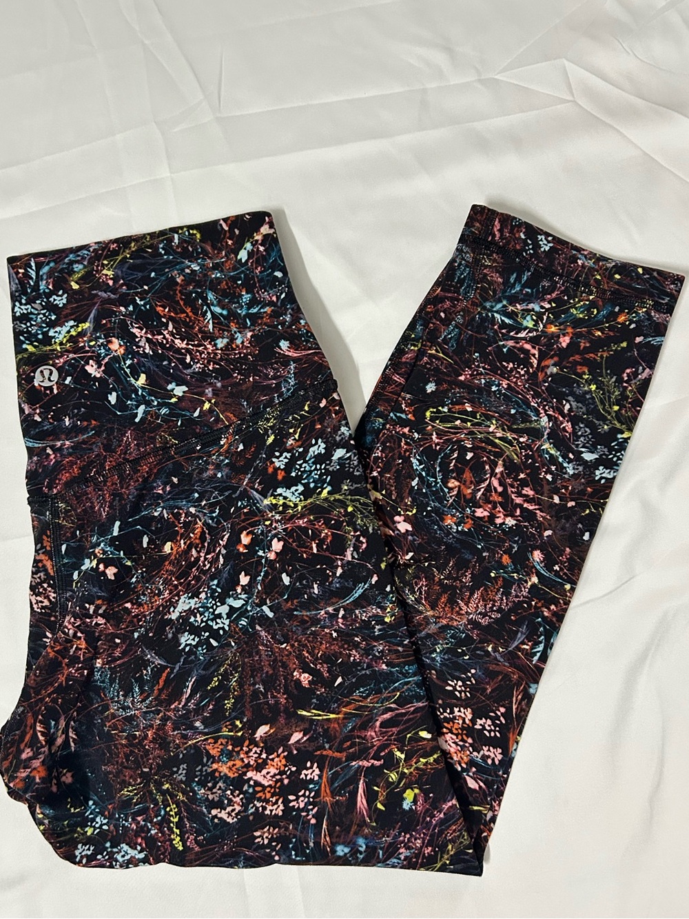 Lululemon black leggings with multicolor abstract splatter design